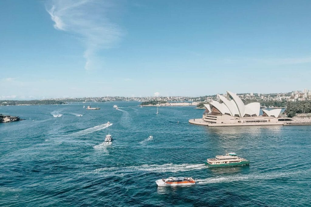 Sydney opera house and boats on the water.