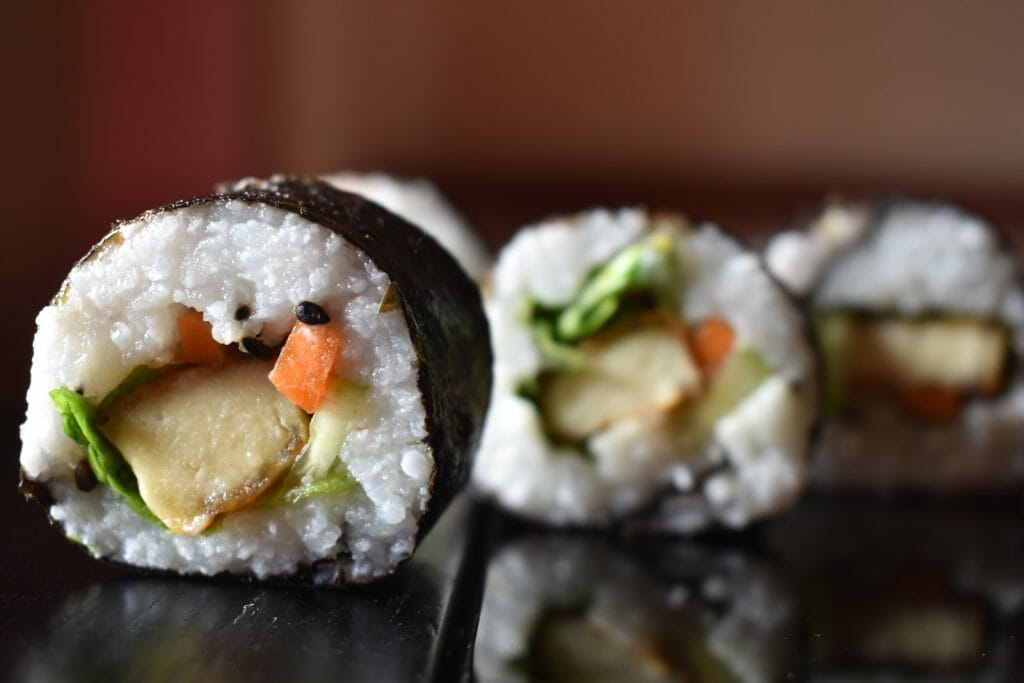 a group of sushi rolls