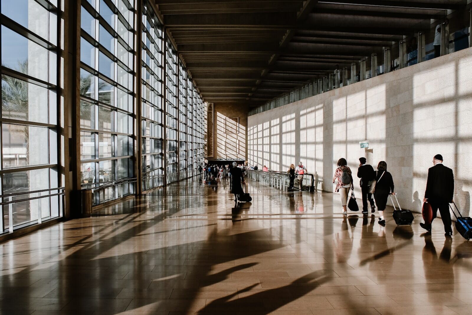 Business travel trends, group of business professionals walking in. the airport