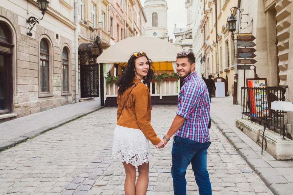 young couple love walking old town