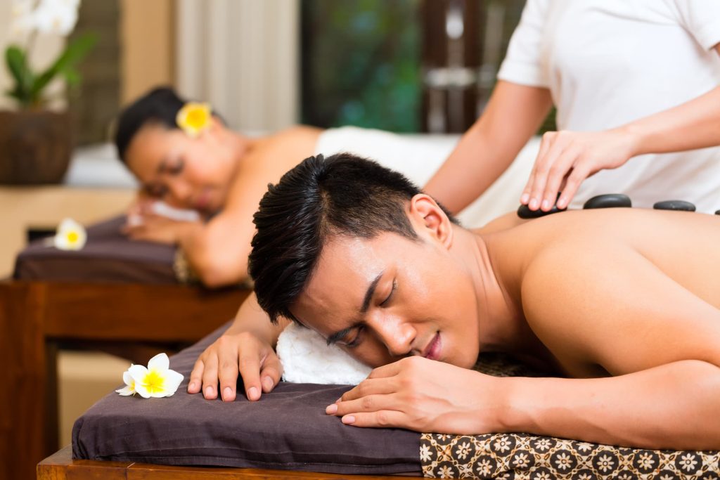 Indonesian couple having wellness massage