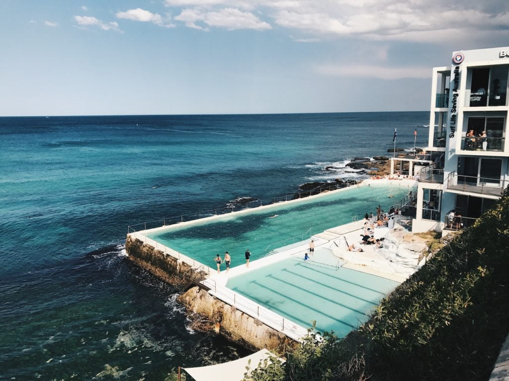 large swimming pool near ocean in landscape photography