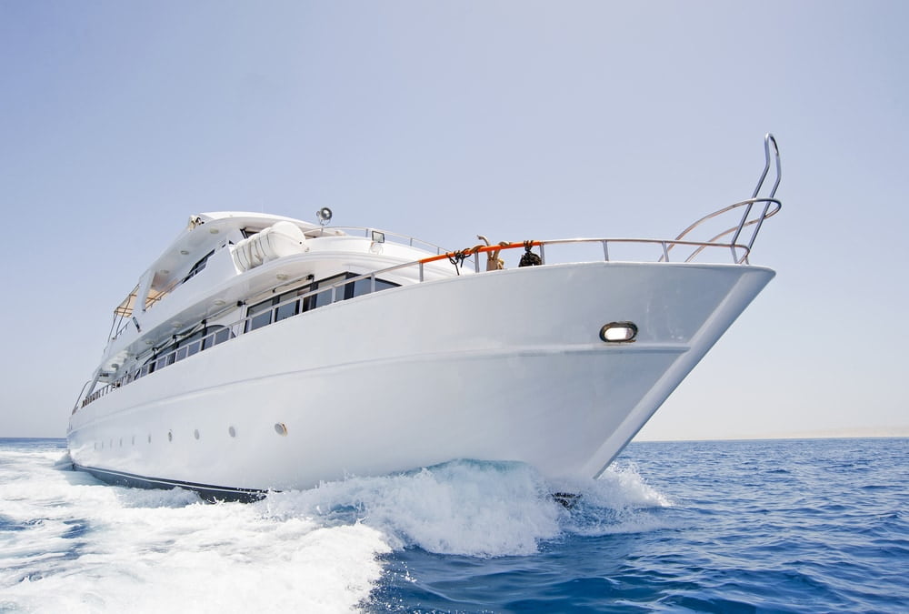 One of the top luxury travel trends is traveling on a Large motor yacht under way at sea — Photo