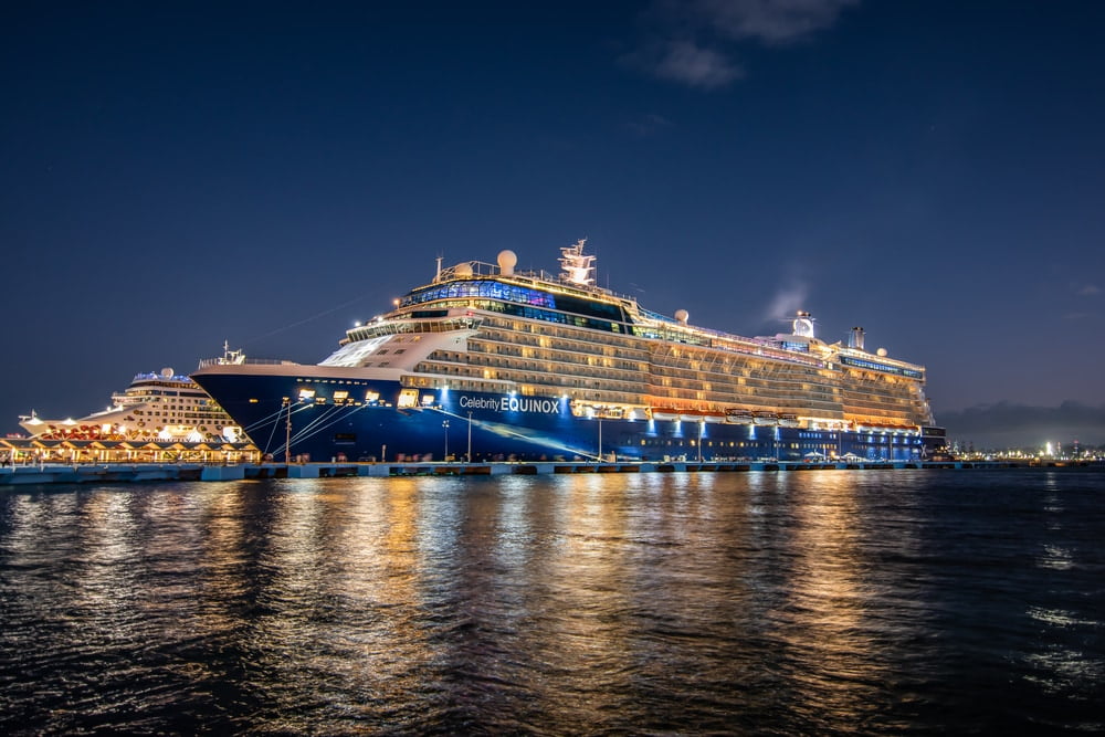 SAN JUAN, PUERTO RICO : USA NOVEMBER 29, 2019 Cruise ships Celebrity Equinox (Celebrity Cruises) and Norwegian Gem (Norwegian Cruise Line) docked at the port of San Juan in Puerto Rico at night