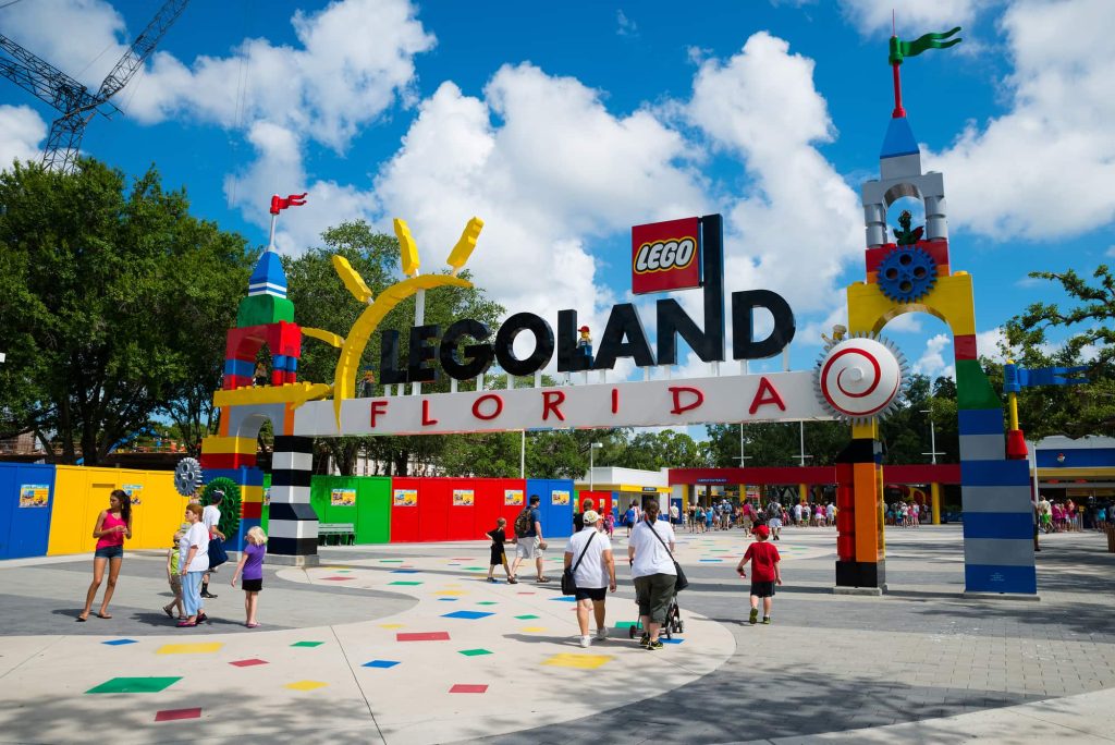 Visitors pass through the entrance to Legoland Florida