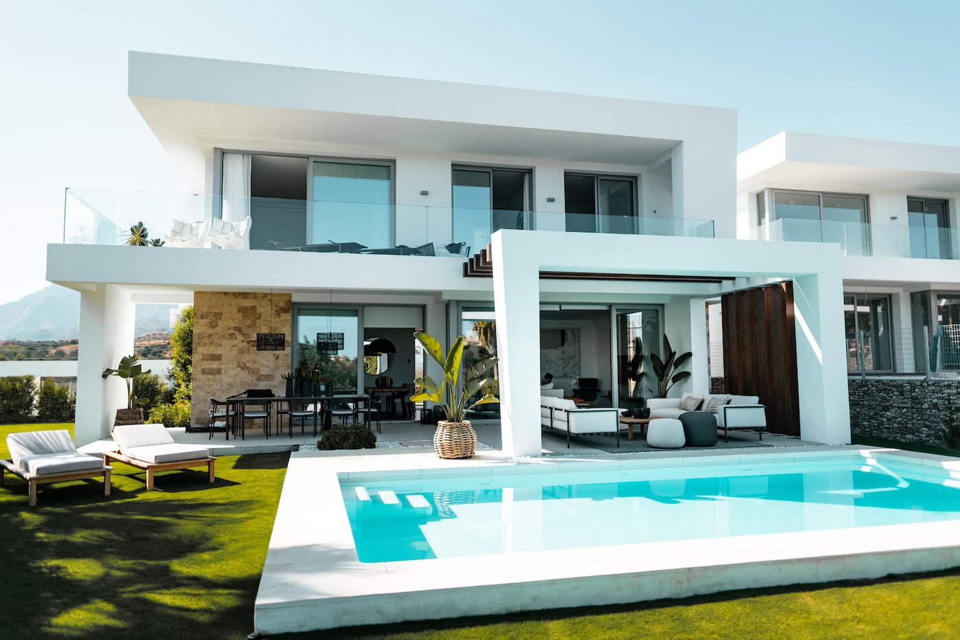 Luxury villa rentals with a white and blue concrete building