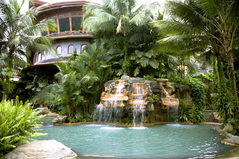 Swimming pool with a waterfall and hot thermal water