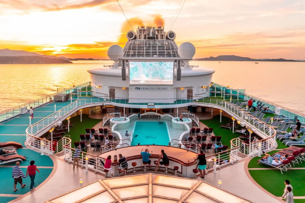 The deck of a luxury cruise ship at sunset on a Caribbean adventure.